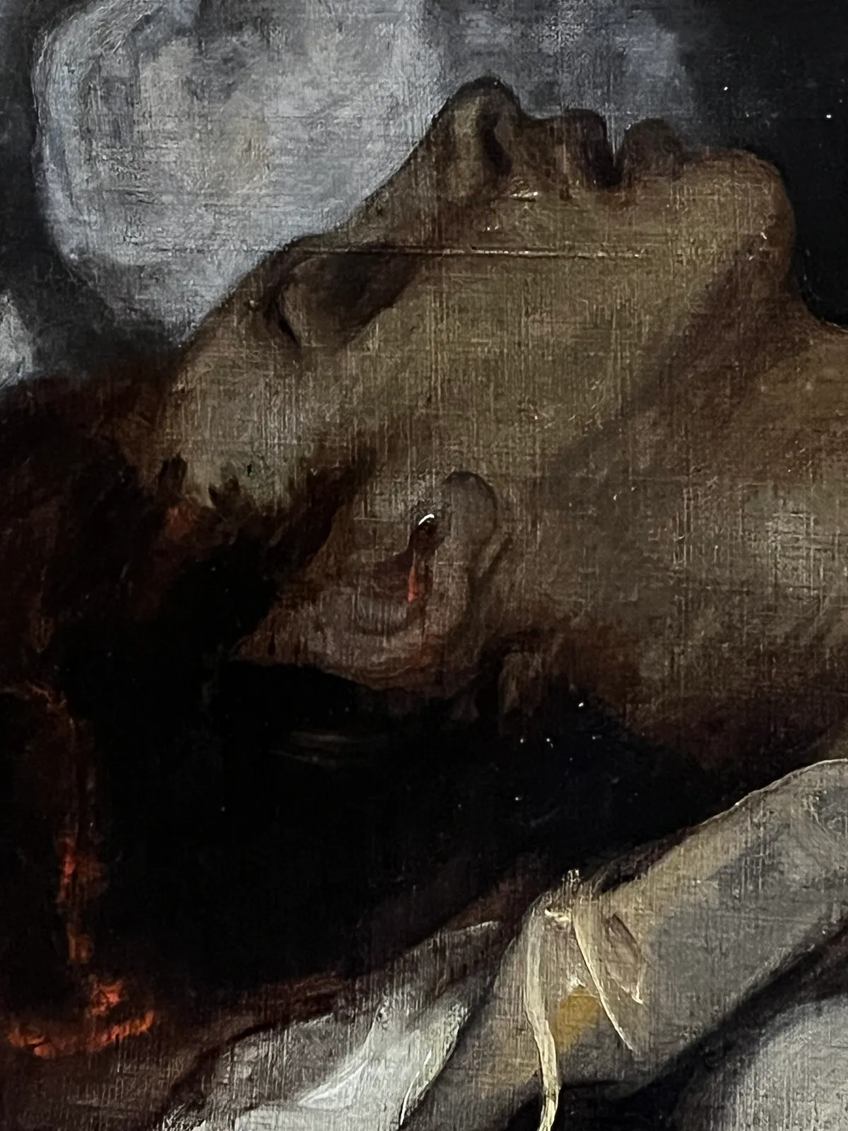 Detail of a fallen soldier, with blood now visible in his ear after the restoration